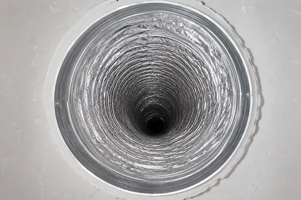 The same Dallas air duct after Warrior cleaning, showing clean bare metal