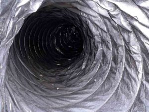Contaminants in a Flexible Air Duct in Dallas TX Dust and contaminants inside a flexible air duct in Dallas, TX