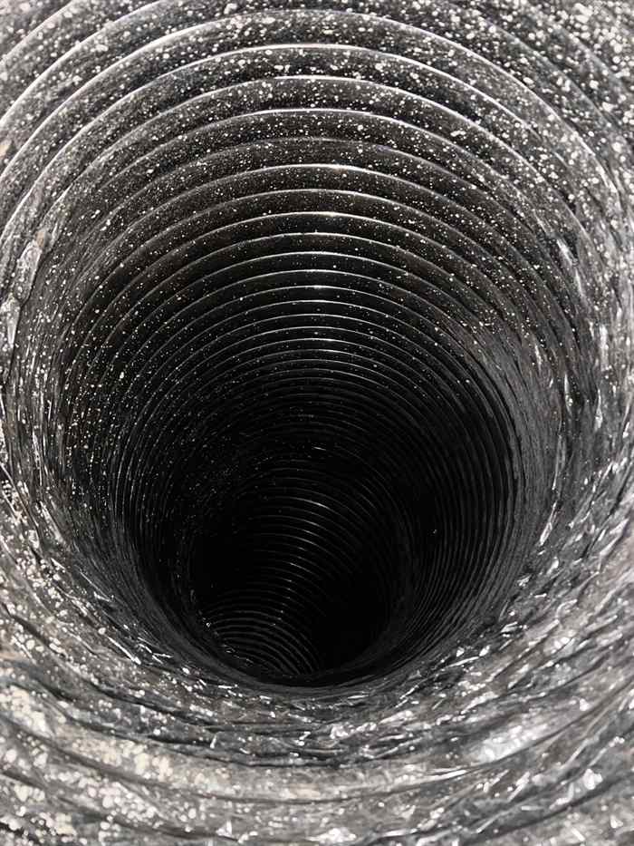 Flexible Return Duct Cleaning in Dallas TX Flexible return air duct interior during cleaning in the Dallas-Fort Worth area
