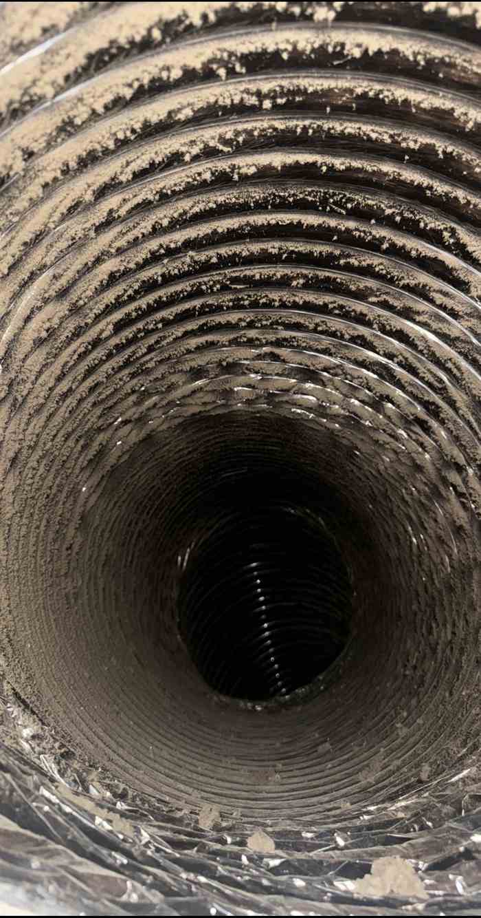 Medium return air duct interior with dust before cleaning in Dallas, TX