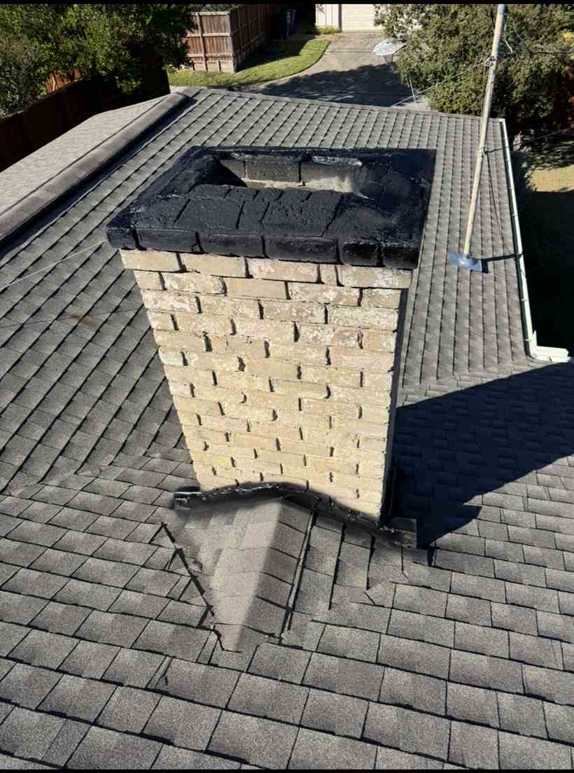 Chimney and roof flashing on a Dallas home serviced by Warrior