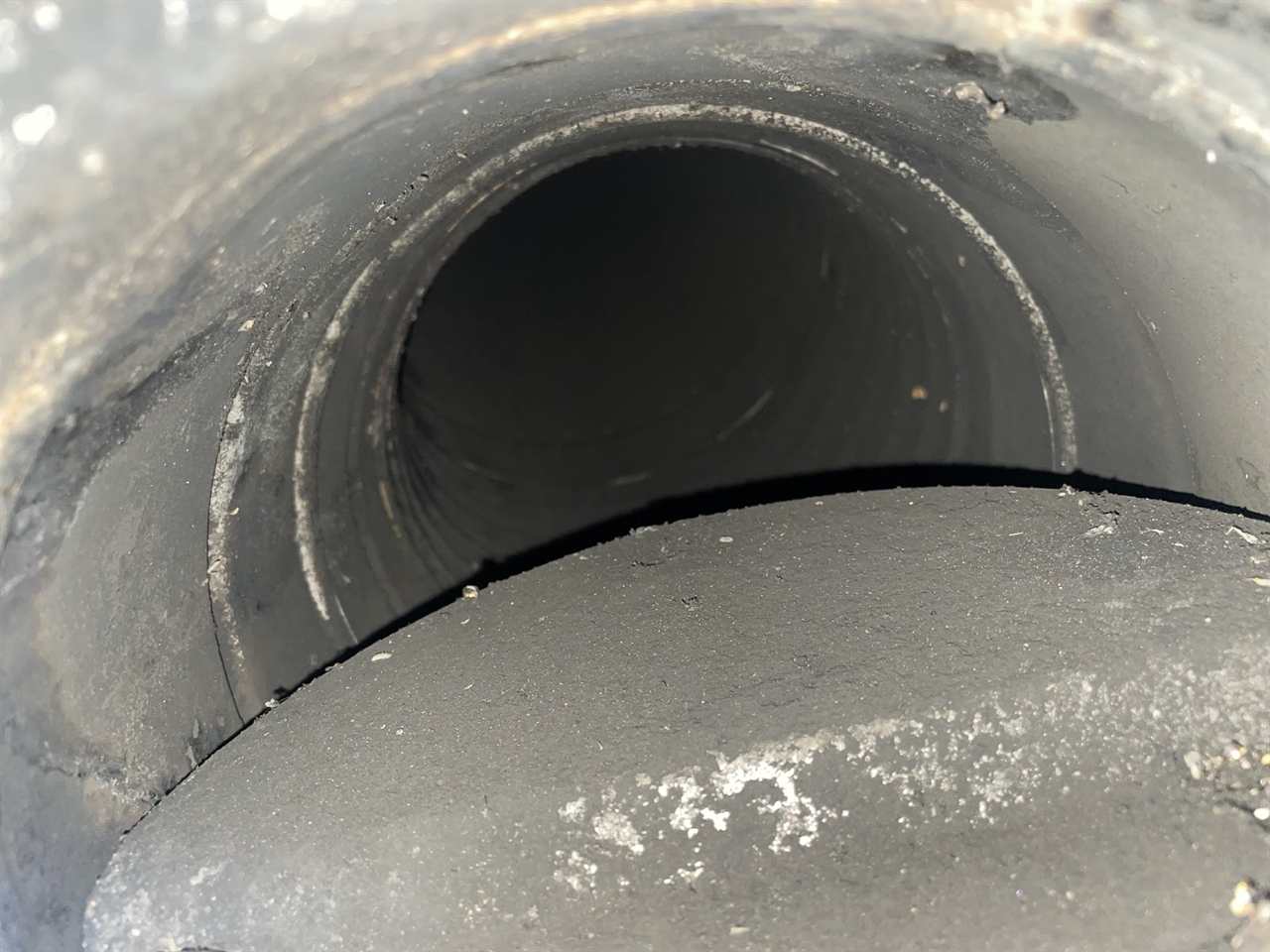 Round metal chimney flue after professional cleaning in the Dallas-Fort Worth area