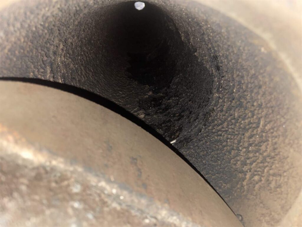 Chimney flue interior viewed during inspection and cleaning in Dallas, TX