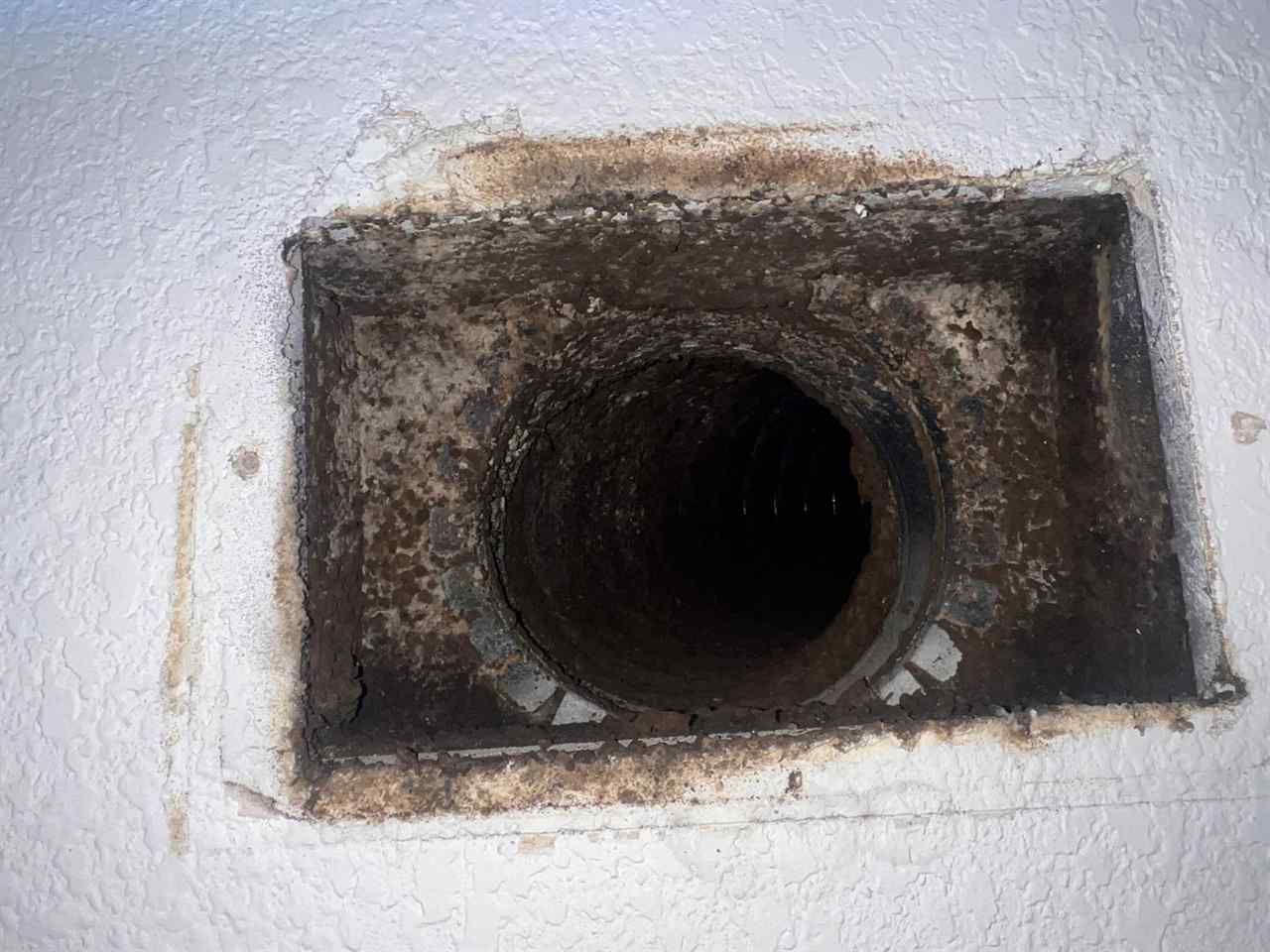 Mold and grime around a supply air vent before sanitizing in Dallas, TX