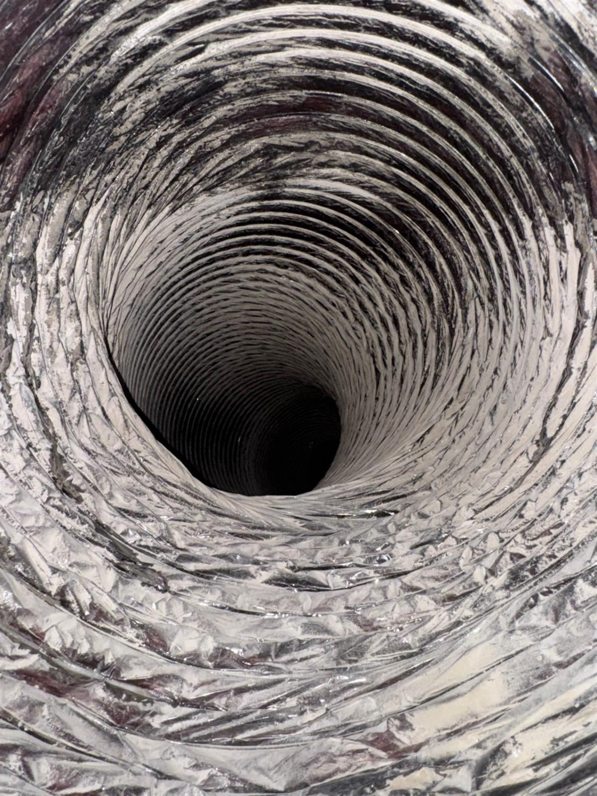 Dusty, streaked flexible duct before cleaning, Frisco
