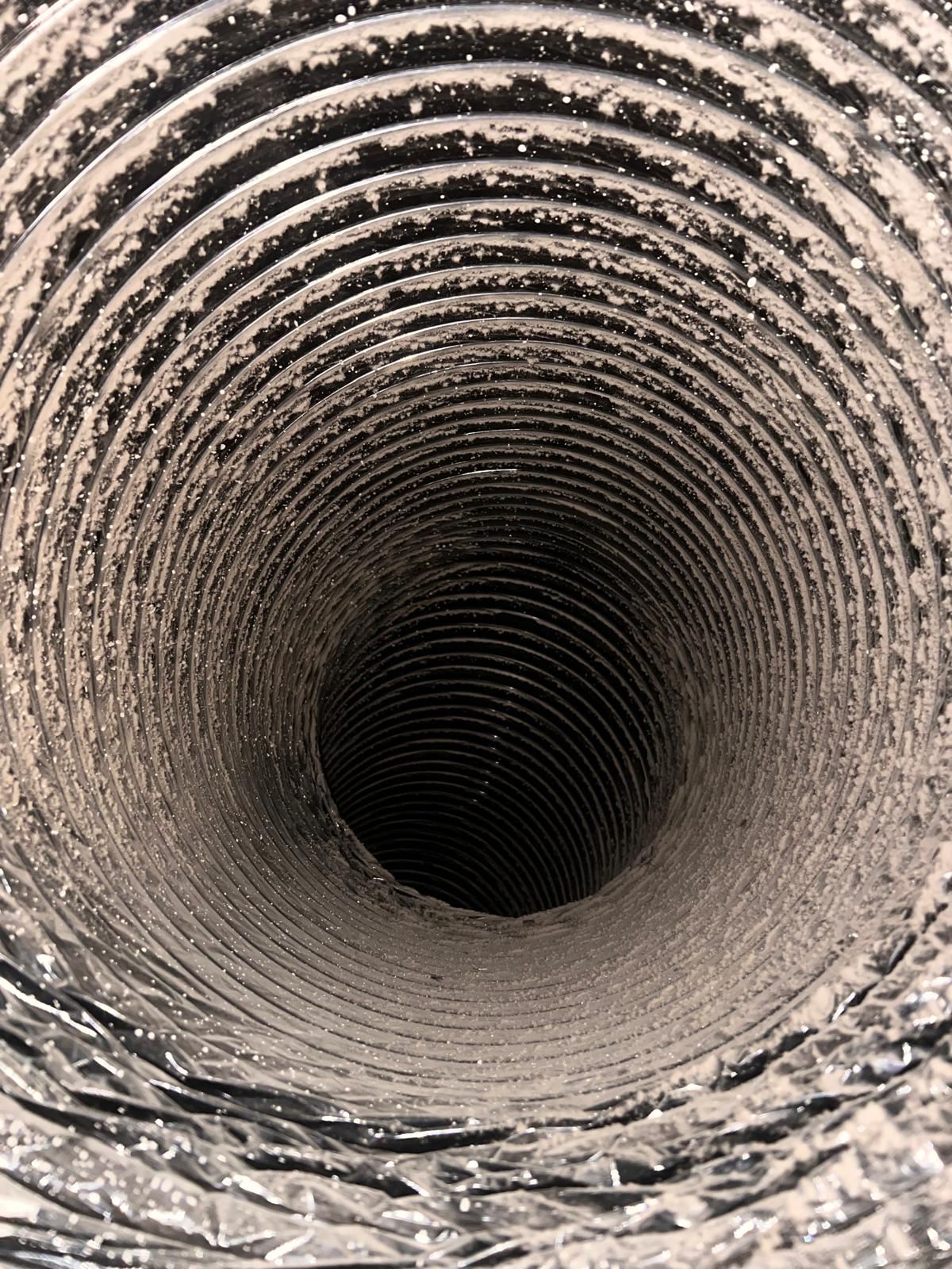 Dust-coated flexible duct before cleaning, Frisco TX